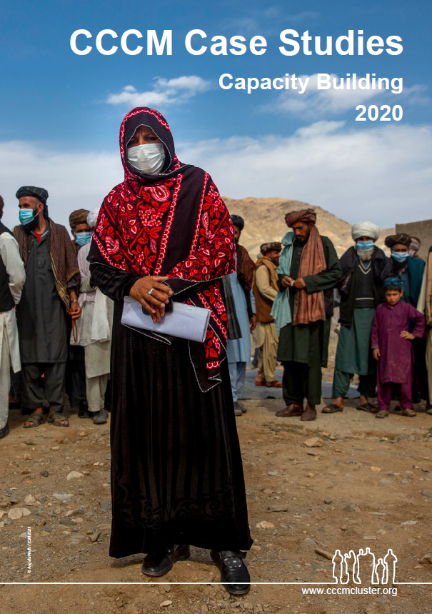 women leader in front of the other community leaders, taken in Afghanistan